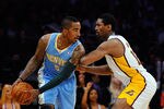 LOS ANGELES, CA - APRIL 03:  Ron Artest #15 of the Los Angeles Lakers defends against JR Smith #5 of the Denver Nuggets at Staples Center on April 3, 2011 in Los Angeles, California. NOTE TO USER: User expressly acknowledges and agrees that, by downloading and or using this photograph, User is consenting to the terms and conditions of the Getty Images License Agreement.  (Photo by Kevork Djansezian/Getty Images)