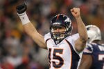 FOXBORO, MA - JANUARY 14:  Tim Tebow #15 of the Denver Broncos celebrates after Willis McGahee #23 scored a 5-yard rushing touchdown in the second quarter against the New England Patriots during their AFC Divisional Playoff Game at Gillette Stadium on January 14, 2012 in Foxboro, Massachusetts.  (Photo by Jim Rogash/Getty Images)