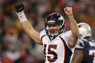 FOXBORO, MA - JANUARY 14:  Tim Tebow #15 of the Denver Broncos celebrates after Willis McGahee #23 scored a 5-yard rushing touchdown in the second quarter against the New England Patriots during their AFC Divisional Playoff Game at Gillette Stadium on January 14, 2012 in Foxboro, Massachusetts.  (Photo by Jim Rogash/Getty Images)