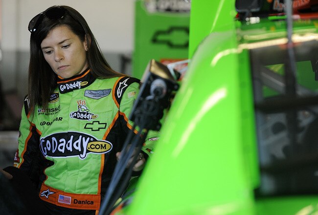 DAYTONA BEACH, FL - JANUARY 12:  Danica Patrick, driver of the #10 GoDaddy.com Chevrolet, stands in the garage area during Daytona Preseason Thunder at Daytona International Speedway on January 12, 2012 in Daytona Beach, Florida.  (Photo by Jared C. Tilton/Getty Images for NASCAR)
