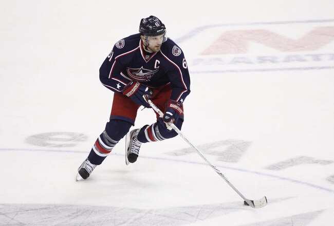 COLUMBUS, OH - JANUARY 19:  Rick Nash #61 of the Columbus Blue Jackets skates the puck up ice during the game against the Nashville Predators at Nationwide Arena on January 19, 2012 in Columbus, Ohio.  The Predators defeated the Blue Jackets 3-0.  (Photo by John Grieshop/Getty Images)