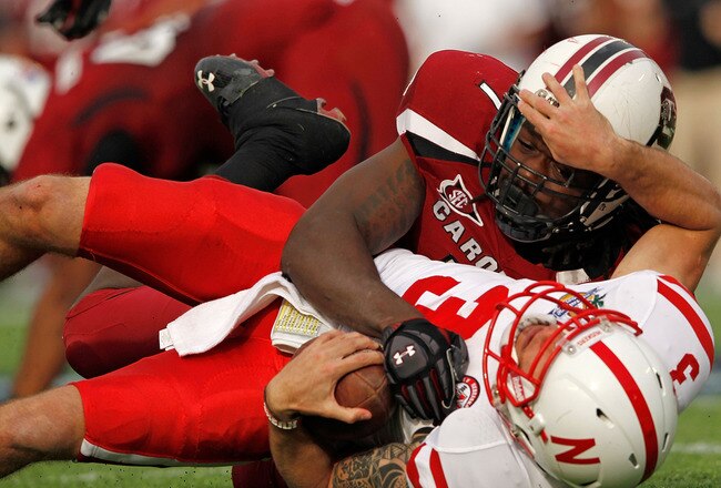 ORLANDO, FL - JANUARY 02:  Taylor Martinez #3 of the Nebraska Cornhuskers is sacked by Jadeveon Clowney #7 of the South Carolina Gamecocks during the Capitol One Bowl  at Florida Citrus Bowl on January 2, 2012 in Orlando, Florida.  (Photo by Mike Ehrmann/Getty Images)