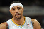 DENVER, CO - MARCH 21:  Kenyon Martin #4 of the Denver Nuggets looks on during a break in the action against the Toronto Raptors at the Pepsi Center on March 21, 2011 in Denver, Colorado. The Nuggets defeated the Raptors 123-90. NOTE TO USER: User expressly acknowledges and agrees that, by downloading and or using this photograph, User is consenting to the terms and conditions of the Getty Images License Agreement.  (Photo by Doug Pensinger/Getty Images)