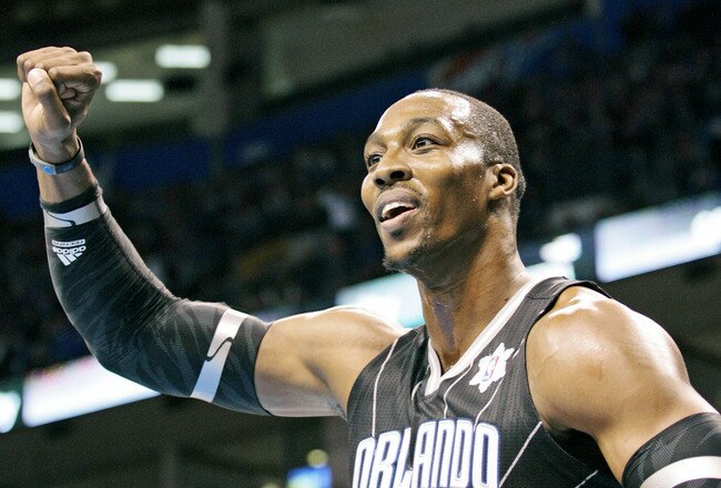 OKLAHOMA CITY, OK - DECEMBER 25:  Dwight Howard #12 of the Orlando Magic looks to have a foul called during the NBA season opening game against the Oklahoma City Thunder December 25, 2011 at the Chesapeake Energy Arena in Oklahoma City, Oklahoma.  Oklahoma City defeated Orlando 97-89. NOTE TO USER: User expressly acknowledges and agrees that, by downloading and or using this Photograph, user is consenting to the terms and conditions of the Getty Images License Agreement.  (Photo by Brett Deering/Getty Images)