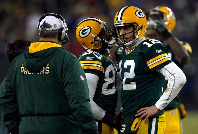 GREEN BAY, WI - JANUARY 15:   Aaron Rodgers #12 of the Green Bay Packers reacts after a play against the New York Giants during their NFC Divisional playoff game at Lambeau Field on January 15, 2012 in Green Bay, Wisconsin.  (Photo by Scott Boehm/Getty Images)