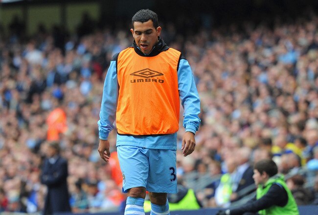 MANCHESTER, ENGLAND - SEPTEMBER 24:  Carlos Tevez of Manchester City looks on from the sidelines during the Barclays Premier League match between Manchester City and Everton at the Etihad Stadium on September 24, 2011 in Manchester, England.  (Photo by Michael Regan/Getty Images)