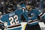 SAN JOSE, CA - JANUARY 07:  Brent Burns #88 (R) of the San Jose Sharks celebrates his power play goal at 19:51 of the second period along with Dan Boyle #22 in their game against the Washington Capitals at the HP Pavilion at San Jose on January 7, 2012 in San Jose, California.  (Photo by Bruce Bennett/Getty Images)