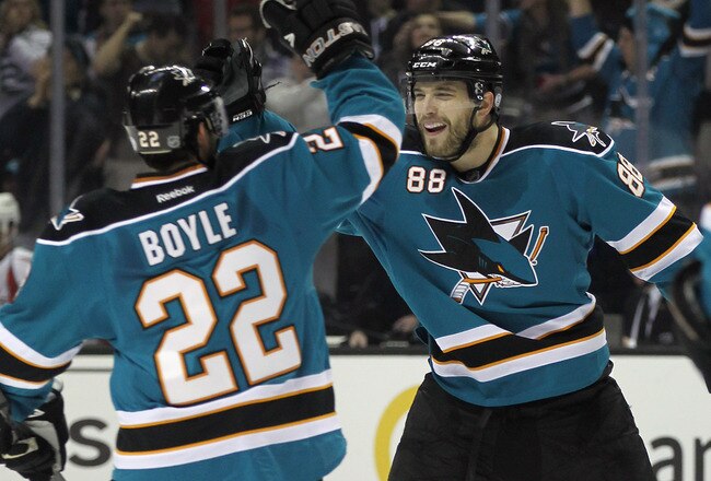 SAN JOSE, CA - JANUARY 07:  Brent Burns #88 (R) of the San Jose Sharks celebrates his power play goal at 19:51 of the second period along with Dan Boyle #22 in their game against the Washington Capitals at the HP Pavilion at San Jose on January 7, 2012 in San Jose, California.  (Photo by Bruce Bennett/Getty Images)
