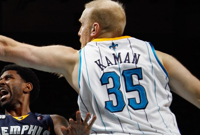 NEW ORLEANS, LA - JANUARY 18:  O.J. Mayo #32 of the Memphis Grizzlies shoots the ball around Chris Kaman #35 of the New Orleans Hornets at New Orleans Arena on January 18, 2012 in New Orleans, Louisiana.  NOTE TO USER: User expressly acknowledges and agrees that, by downloading and or using this photograph, User is consenting to the terms and conditions of the Getty Images License Agreement.  (Photo by Chris Graythen/Getty Images)