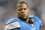 DETROIT, MI - NOVEMBER 24: Ndamukong Suh #90 of the Detroit Lions talks with the official during the game against the Green Bay Packers at Ford Field on November 24, 2011 in Detroit, Michigan. The Packers defeated the Lions 27-15.  (Photo by Leon Halip/Getty Images)
