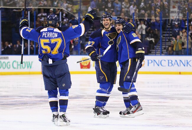 ST. LOUIS, MO - JANUARY 5: David Perron #57, Carlo Colaiacovo #28, and Alex Pietrangelo #27 all of the St. Louis Blues celebrate a goal against the Edmonton Oilers at the Scottrade Center  on January 5, 2012 in St. Louis, Missouri.  The Blues beat the Oilers 4-3.  (Photo by Dilip Vishwanat/Getty Images)