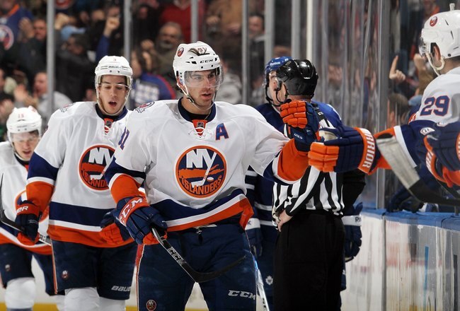 UNIONDALE, NY - JANUARY 24:  John Tavares #91 of the New York Islanders in action against the Toronto Maple Leafs on January 24, 2012 at Nassau Coliseum in Uniondale, New York. The Maple Leafs defeated the Islanders 4-3 after overtime.  (Photo by Jim McIsaac/Getty Images)