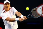 MELBOURNE, AUSTRALIA - JANUARY 24: Tomas Berdych of the Czech Republic hits a backhand in his quarter final match against Rafael Nadal of Spain during day nine of the 2012 Australian Open at Melbourne Park on January 24, 2012 in Melbourne, Australia.  (Photo by Mark Dadswell/Getty Images)