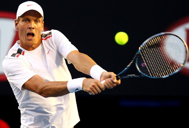 MELBOURNE, AUSTRALIA - JANUARY 24: Tomas Berdych of the Czech Republic hits a backhand in his quarter final match against Rafael Nadal of Spain during day nine of the 2012 Australian Open at Melbourne Park on January 24, 2012 in Melbourne, Australia.  (Photo by Mark Dadswell/Getty Images)