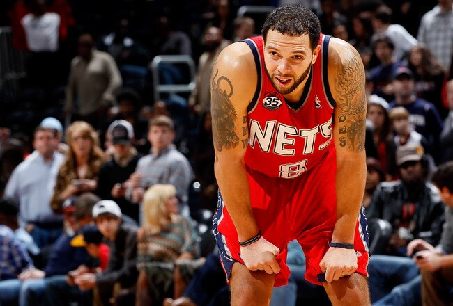 ATLANTA, GA - DECEMBER 30:  Deron Williams #8 of the New Jersey Nets reacts in the final seconds of their 105-98 loss to the Atlanta Hawks at Philips Arena on December 30, 2011 in Atlanta, Georgia.  NOTE TO USER: User expressly acknowledges and agrees that, by downloading and or using this photograph, User is consenting to the terms and conditions of the Getty Images License Agreement.  (Photo by Kevin C. Cox/Getty Images)