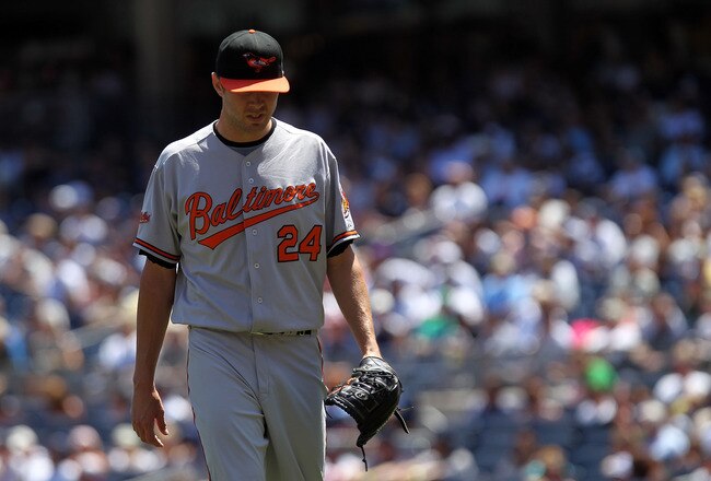 NEW YORK, NY - JULY 30:  Chris Tillman #24 of the Baltimore Orioles walks to the dugout against the New York Yankees  during game one of their double header on July 30, 2011 at Yankee Stadium in the Bronx borough of New York City.  (Photo by Nick Laham/Getty Images)
