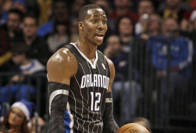 OKLAHOMA CITY, OK - DECEMBER 25:  Dwight Howard #12 of the Orlando Magic questions a call during the NBA season opening game against the Oklahoma City Thunder December 25, 2011 at the Chesapeake Energy Arena in Oklahoma City, Oklahoma.  Oklahoma City defeated Orlando 97-89. NOTE TO USER: User expressly acknowledges and agrees that, by downloading and or using this Photograph, user is consenting to the terms and conditions of the Getty Images License Agreement.  (Photo by Brett Deering/Getty Images)