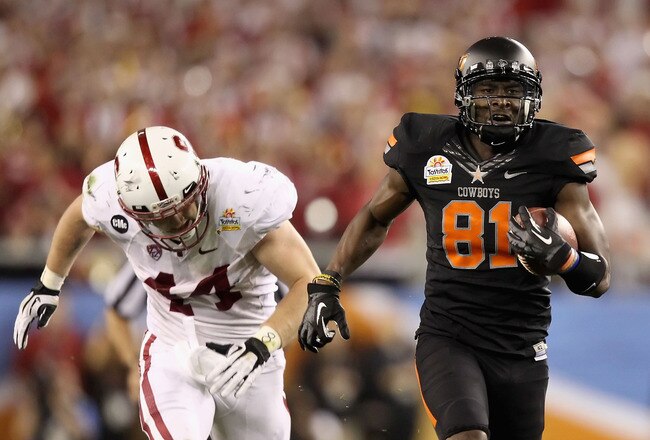 GLENDALE, AZ - JANUARY 02:  Justin Blackmon #81 of the Oklahoma State Cowboys catches a 67-yard touchdown reception in the second quarter against Chase Thomas #44 of the Stanford Cardina during the Tostitos Fiesta Bowl on January 2, 2012 at University of Phoenix Stadium in Glendale, Arizona.(Photo by Christian Petersen/Getty Images)