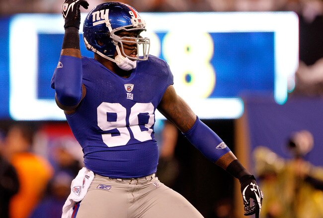 EAST RUTHERFORD, NJ - JANUARY 01:  Jason Pierre-Paul #90 of the New York Giants reacts after a sack in the first quarter against the Dallas Cowboys at MetLife Stadium on January 1, 2012 in East Rutherford, New Jersey.  (Photo by Rich Schultz/Getty Images)