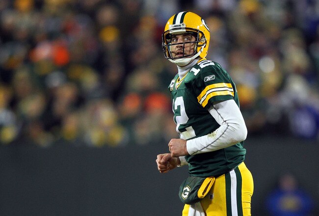 GREEN BAY, WI - JANUARY 15:  Aaron Rodgers #12 of the Green Bay Packers looks on in the third quarter against the New York Giants during their NFC Divisional playoff game at Lambeau Field on January 15, 2012 in Green Bay, Wisconsin.  (Photo by Jamie Squire/Getty Images)