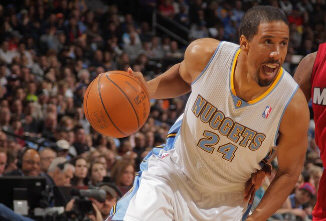 DENVER, CO - JANUARY 13:  Andre Miller #24 of the Denver Nuggets controls the ball against the Miami Heat at the Pepsi Center on January 13, 2012 in Denver, Colorado. The Nuggets defeated the Heat 117-104. NOTE TO USER: User expressly acknowledges and agrees that, by downloading and or using this photograph, User is consenting to the terms and conditions of the Getty Images License Agreement.  (Photo by Doug Pensinger/Getty Images)