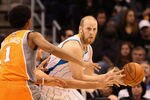 PHOENIX, AZ - DECEMBER 26:  Chris Kaman #35 of the New Orleans Hornets handles the ball during the season openning NBA game against the Phoenix Suns at US Airways Center on December 26, 2011 in Phoenix, Arizona.  The Hornets defeated the Suns 85-84. NOTE TO USER: User expressly acknowledges and agrees that, by downloading and or using this photograph, User is consenting to the terms and conditions of the Getty Images License Agreement.  (Photo by Christian Petersen/Getty Images)