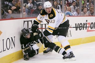 PITTSBURGH - DECEMBER 30: Defenseman Zdeno Chara #33 of the Boston Bruins checks forward Evgeni Malkin #71 of the Pittsburgh Penguins on December 30, 2008 at Mellon Arena in Pittsburgh, Pennsylvania.  (Photo by Jamie Sabau/Getty Images)