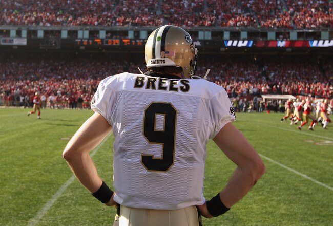 SAN FRANCISCO, CA - JANUARY 14:  Quarterback Drew Brees #9 of the New Orleans Saints watch from the sidelines during the second quarter of the NFC Divisional playoff game against the San Francisco 49ers at Candlestick Park on January 14, 2012 in San Francisco, California.  (Photo by Ezra Shaw/Getty Images)