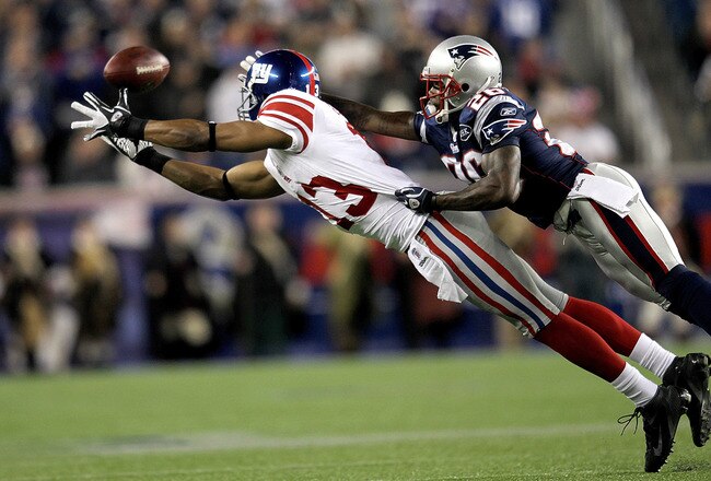 FOXBORO, MA - NOVEMBER 6:   Ramses Barden #13 of the New York Giants comes up short against the defense of  Phillip Adams #26 of the New England Patriots at Gillette Stadium in the second half on November 6, 2011 in Foxboro, Massachusetts. (Photo by Jim Rogash/Getty Images)
