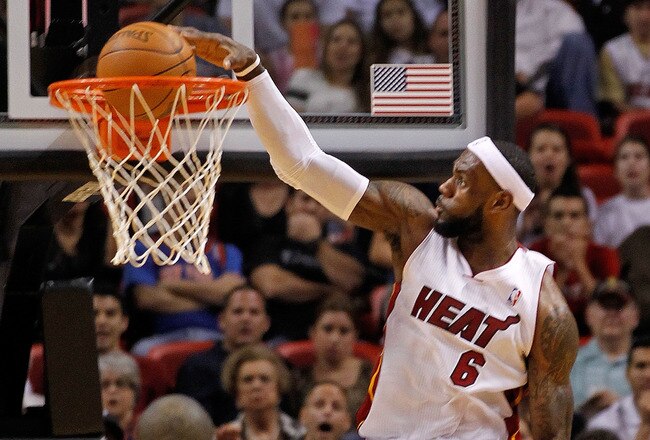 MIAMI, FL - JANUARY 27:  LeBron James #6 of the Miami Heat dunks during a game against the New York Knicks at American Airlines Arena on January 27, 2012 in Miami, Florida. NOTE TO USER: User expressly acknowledges and agrees that, by downloading and/or using this Photograph, User is consenting to the terms and conditions of the Getty Images License Agreement.  (Photo by Mike Ehrmann/Getty Images)