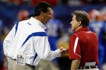 ATLANTA - DECEMBER 06:  Head coach Nick Saban of the Alabama Crimson Tide shakes hands with Urban Meyer, head coach of the Florida Gators before the start of the SEC Championship on December 6, 2008 at the Georgia Dome in Atlanta, Georgia.  (Photo by Chris Graythen/Getty Images)