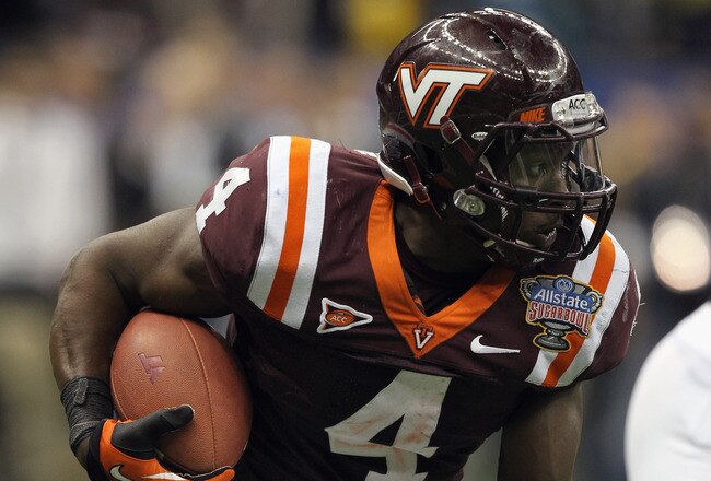 NEW ORLEANS, LA - JANUARY 03:  David Wilson #4 of the Virginia Tech Hokies runs the ball against the Michigan Wolverines during the Allstate Sugar Bowl at Mercedes-Benz Superdome on January 3, 2012 in New Orleans, Louisiana.  (Photo by Matthew Stockman/Getty Images)