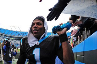 CHARLOTTE, NC - DECEMBER 24: Cam Newton #1 of the Carolina Panthers celebrates with fans after the game against the Tampa Bay Buccaneers at Bank of America Stadium on December 24, 2011 in Charlotte, North Carolina  (Photo by Scott Cunningham/Getty Images)