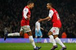LONDON, ENGLAND - JANUARY 29:  Theo Walcott of Arsenal (14) celebrates with team mate Alex Oxlade-Chamberlain as he scores their second gaol during the FA Cup with Budweiser Fourth Round match between Arsenal and Aston Villa at Emirates Stadium on January 29, 2012 in London, England.  (Photo by Paul Gilham/Getty Images)