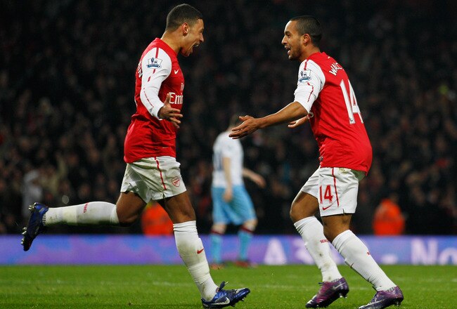 LONDON, ENGLAND - JANUARY 29:  Theo Walcott of Arsenal (14) celebrates with team mate Alex Oxlade-Chamberlain as he scores their second gaol during the FA Cup with Budweiser Fourth Round match between Arsenal and Aston Villa at Emirates Stadium on January 29, 2012 in London, England.  (Photo by Paul Gilham/Getty Images)