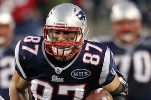FOXBORO, MA - JANUARY 22:   Rob Gronkowski #87 of the New England Patriots runs with the ball against the Baltimore Ravens during their AFC Championship Game at Gillette Stadium on January 22, 2012 in Foxboro, Massachusetts.  (Photo by Jim Rogash/Getty Images)