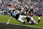 CHARLOTTE, NC - DECEMBER 24:  Jeremy Shockey #80 of the Carolina Panthers dives for a touchdown against Ahmad Black #43 of the Tampa Bay Buccaneers during their game at Bank of America Stadium on December 24, 2011 in Charlotte, North Carolina.  (Photo by Streeter Lecka/Getty Images)