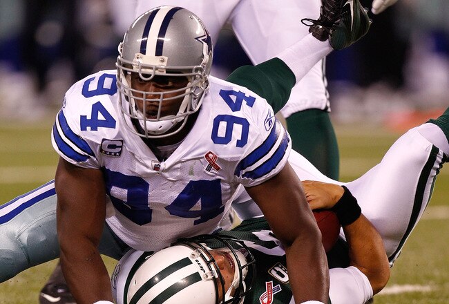 EAST RUTHERFORD, NJ - SEPTEMBER 11:  DeMarcus Ware #94 of the Dallas Cowboys sacks Mark Sanchez #6 of the New York Jets in the first half during their NFL Season Opening Game at MetLife Stadium on September 11, 2011 in East Rutherford, New Jersey.  (Photo by Jeff Zelevansky/Getty Images)
