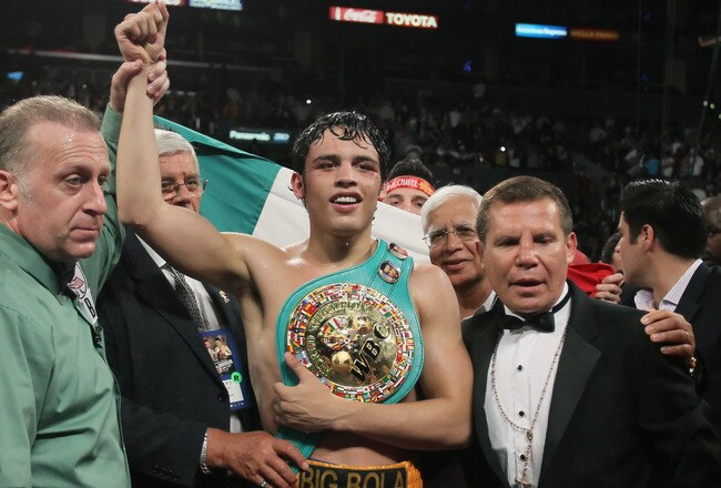 LOS ANGELES, CA - JUNE 04:  (R-L) Referee Jack Reiss, Julio Cesar Chavez Jr. of Mexico and Julio Cesar Chavez Sr. of Mexico pose following the WBC World Middleweight Title bout with Sebastian Zbik of Germany at Staples Center on June 4, 2011 in Los Angeles, California.  (Photo by Jeff Gross/Getty Images)