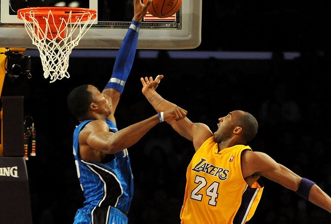 LOS ANGELES, CA - JANUARY 18:  Dwight Howard #12 of the Orlando Magic blocks the shot by Kobe Bryant #24 of the Los Angeles Lakers in the fourth quarter during the game on January 18, 2010 at Staples Center in Los Angeles, California. NOTE TO USER: User expressly acknowledges and agrees that, by downloading and/or using this Photograph, user is consenting to the terms and conditions of the Getty Images License Agreement.  (Photo by Harry How/Getty Images)