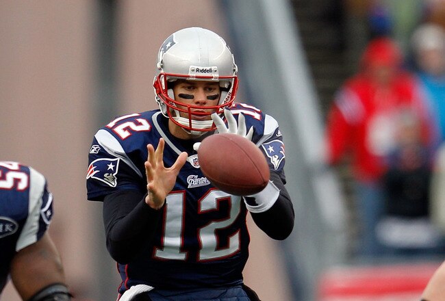 FOXBORO, MA - JANUARY 22:  Tom Brady #12 of the New England Patriots hikes the ball against the Baltimore Ravens during their AFC Championship Game at Gillette Stadium on January 22, 2012 in Foxboro, Massachusetts.  (Photo by Rob Carr/Getty Images)