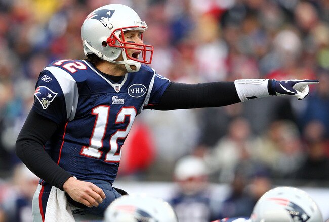 FOXBORO, MA - JANUARY 22:   Tom Brady #12 of the New England Patriots points against the Baltimore Ravens during their AFC Championship Game at Gillette Stadium on January 22, 2012 in Foxboro, Massachusetts.  (Photo by Al Bello/Getty Images)