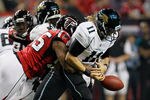 ATLANTA, GA - DECEMBER 15:  John Abraham #55 of the Atlanta Falcons forces a fumble as he sacks Blaine Gabbert #11 of the Jacksonville Jaguars in the first half at the Georgia Dome on December 15, 2011 in Atlanta, Georgia.  (Photo by Kevin C. Cox/Getty Images)
