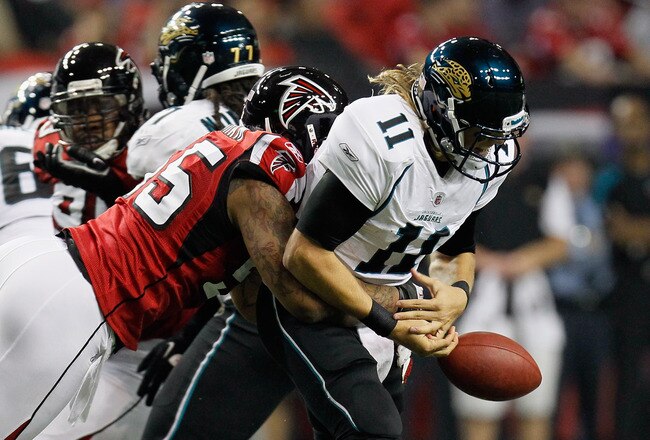 ATLANTA, GA - DECEMBER 15:  John Abraham #55 of the Atlanta Falcons forces a fumble as he sacks Blaine Gabbert #11 of the Jacksonville Jaguars in the first half at the Georgia Dome on December 15, 2011 in Atlanta, Georgia.  (Photo by Kevin C. Cox/Getty Images)