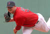 BOSTON, MA - AUGUST 27:  Jon Lester #31 of the Boston Red Sox throws against the Oakland Athletics at Fenway Park August 27, 2011 in Boston, Massachusetts. (Photo by Jim Rogash/Getty Images)