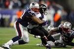 FOXBORO, MA - JANUARY 22:   Jerod Mayo #51 of the New England Patriots tackles Ray Rice #27 of the Baltimore Ravens during their AFC Championship Game at Gillette Stadium on January 22, 2012 in Foxboro, Massachusetts.  (Photo by Al Bello/Getty Images)