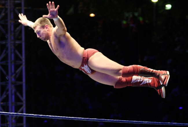 DURBAN, SOUTH AFRICA - JULY 08:  WWE Superstar Daniel Bryan flys off the ropes during the WWE Smackdown Live Tour at Westridge Park Tennis Stadium on July 08, 2011 in Durban, South Africa.  (Photo by Steve Haag/Gallo Images/Getty Images)
