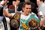 LAS VEGAS, NV - FEBRUARY 19:  Nonito Donaire of the Philippines celebrates his second-round TKO victory over Fernando Montiel of Mexico during their WBC/WBO bantamweight championship bout at the Mandalay Bay Events Center February 19, 2011 in Las Vegas, Nevada.  (Photo by Ethan Miller/Getty Images)
