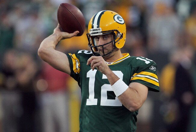 GREEN BAY, WI - SEPTEMBER 08:   Aaron Rodgers #12 of the Green Bay Packers warms before taking on the New Orleans Saints in the season opening game at Lambeau Field on September 8, 2011 in Green Bay, Wisconsin.  (Photo by Jonathan Daniel/Getty Images)