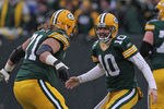 GREEN BAY, WI - JANUARY 01:  Matt Flynn #10 of the Green Bay Packers celebrates a touchdown pass with Josh Sitton #71 against the Detroit Lions at Lambeau Field on January 1, 2012 in Green Bay, Wisconsin. The Packers defeated the Lions 45-41.  (Photo by Jonathan Daniel/Getty Images)